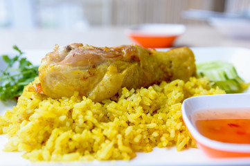 Chicken Biryani with green chutney, islamic food.