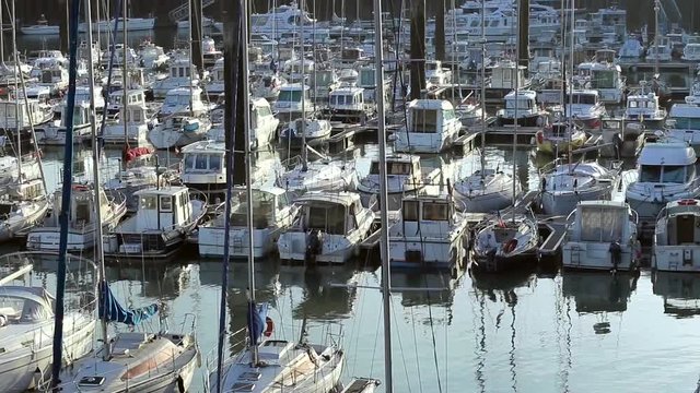 Yachts and sailboats moored in a harbor of Dieppe, France. Vacation, luxury lifestyle and wealth concept