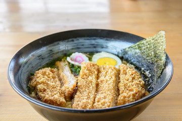 Tonkatsu ramen,noodle soup with battle fired pork,japanese food.