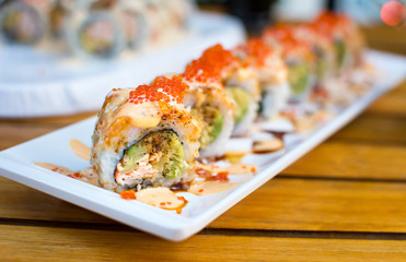 Sushi rolls on a plate in a restaurant