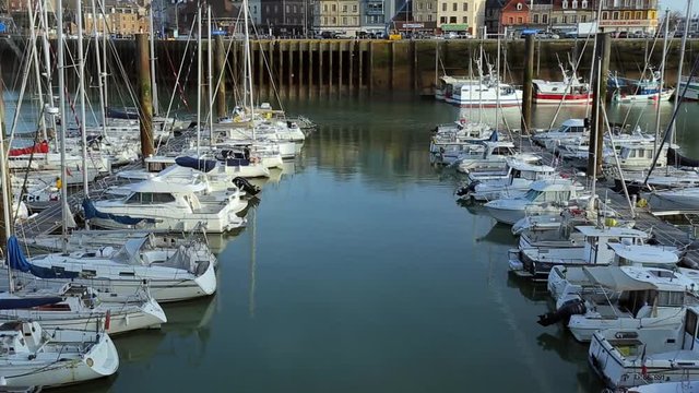 Yachts and sailboats moored in a harbor of Dieppe, France. Vacation, luxury lifestyle and wealth concept