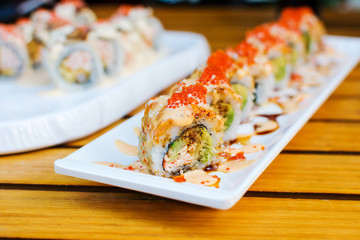 Sushi rolls on a plate in a restaurant