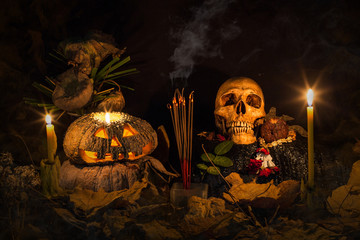 Skull and pumpkin with faith in thai style on dark Halloween night