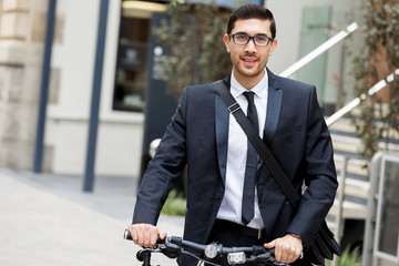 Young businessmen with a bike