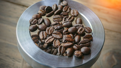 coffee beans over wooden background on Food and Drink theme with selected focus