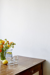 variety of vases with flowers on vintage wooden table