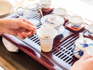 herbal flower hot tea on white cup in process