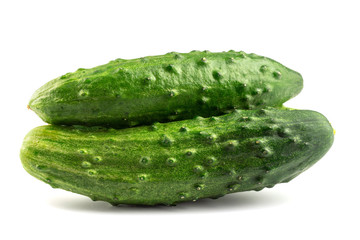 Two fresh cucumbers isolated on white background, close-up view