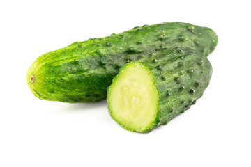 Whole and sliced cucumber isolated on white background, close-up view