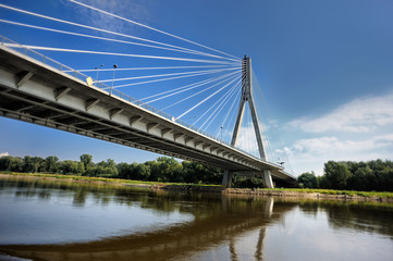 Modern Swietokrzyski bridge in Warsaw over Vistula river, Poland