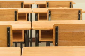 School empty classroom with desks chair wood with greenboard, in high school, education concept