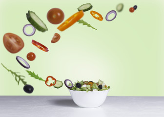 Obraz na płótnie Canvas salad with flying vegetables