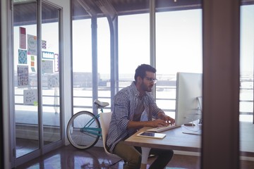 Businessman working on computer in office