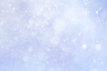 Snowfall texture of snowflakes on blurred background