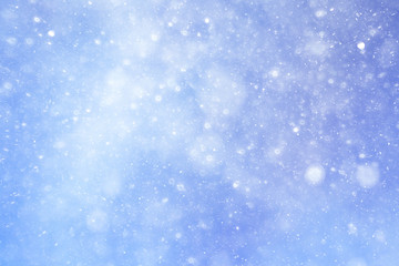Snowfall texture of snowflakes on blurred background