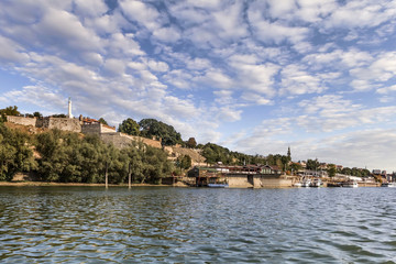 Fototapeta na wymiar Belgrade Panorama with Kalemegdan Fortress and Tourist Nautical Port Viewed From Sava River Perspective