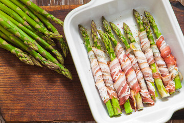 Baked green asparagus wrapped with bacon