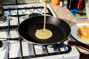 Cooking pancakes in a frying pan.