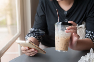 Woman hand using mobile phone