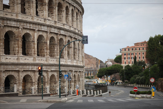 Roman street with a fragment of the wall of the Colosseum. Italy