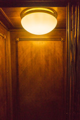 Bright light illuminates old lift carriage