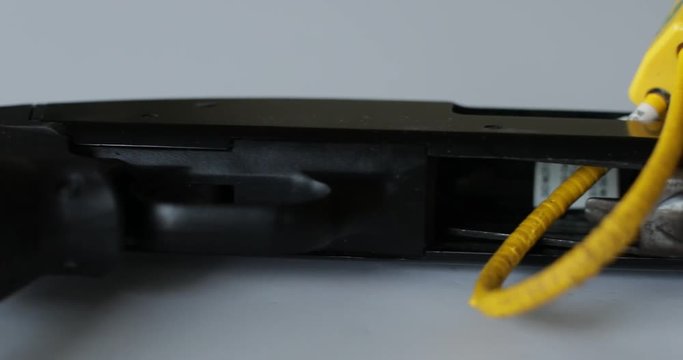 A trigger lock on a shotgun for safety