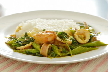 spicy stir fried shrimp and squid curry eat couple with rice