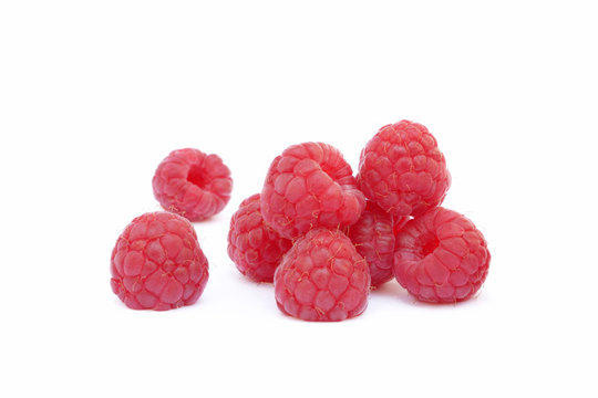 Sweet ripe raspberries isolated on white background