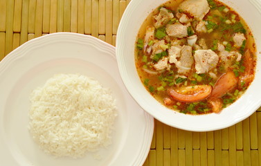 hot and spicy pork bone tamarind and Thai herbs soup eat couple with rice
