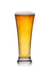 Glass of cold beer with foam isolated.