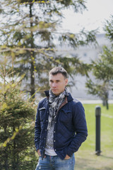 Portrait of a young handsome man, model of fashion