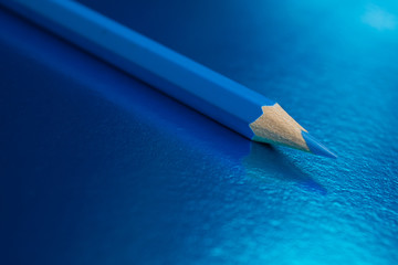blue pencil on a blue background
