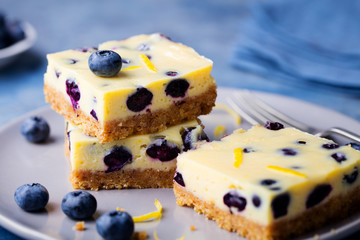 Blueberry cake cheesecake on plate Blue background