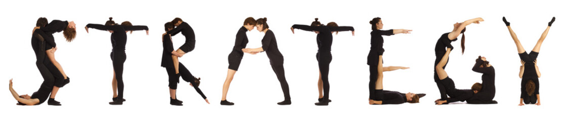 Black dressed people forming word STRATEGY