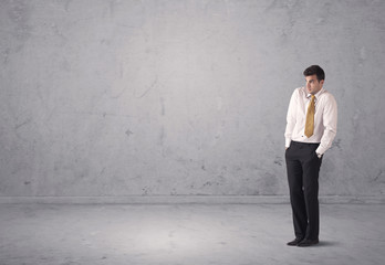 Fototapeta premium Young businessman standing confused