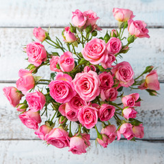 Rose flowers in vase. Copy space. Top view