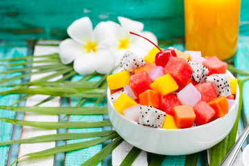 Exotic fruit salad. Healthy breakfast. Copy space.