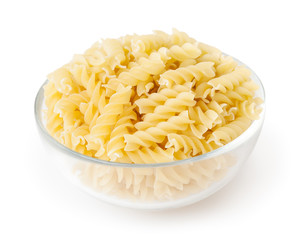 Fusilli pasta in bowl isolated on white background with clipping path