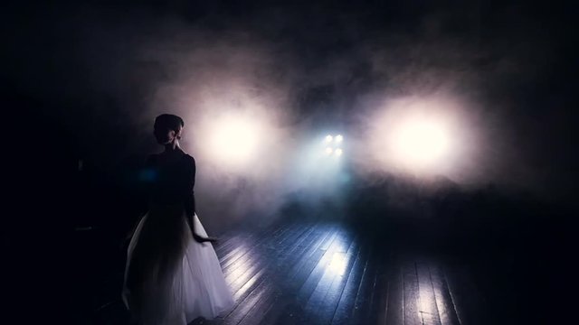 Woman dancing in the long tutu dress. Slow motion. Dolly. HD.