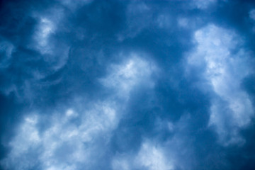 Beautiful clouds at sunset after rain as background .