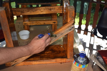  Arranging old wooden chairs, wood varnishing