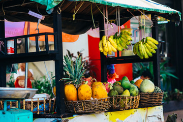 Street food counter with fruits on the street of Vientiane, Laos