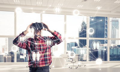 Guy wearing checked shirt and virtual mask demonstrating some em