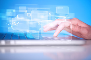 Hand touching keyboard with high tech buttons