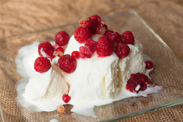 Delicious ice cream with fresh frozen raspberries and currant