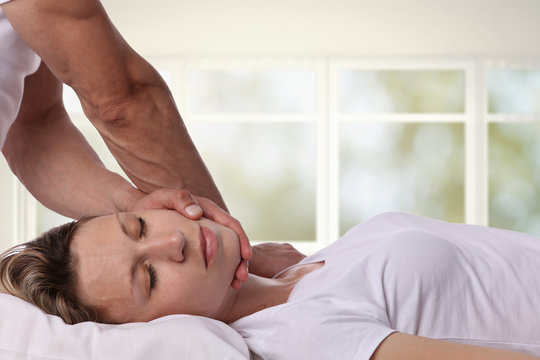 Chiropractic, osteopathy, manual therapy, acupressure. Therapist doing healing treatment on man's back. Alternative medicine, pain relief concept.