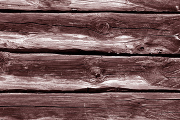 Red log house wall.