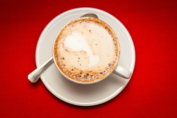 A cup of cappuccino on the table