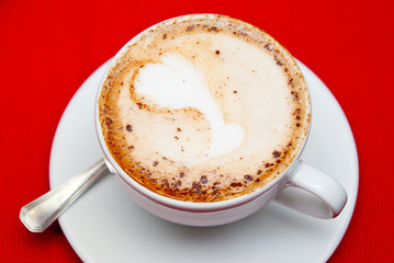 A cup of cappuccino on the table