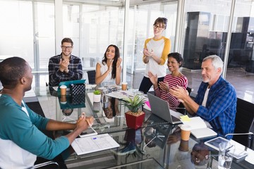 Business people applauding during meeting